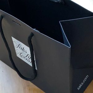 Small black Saks Fifth Ave shopping bag with original Saks snowflake ribbon